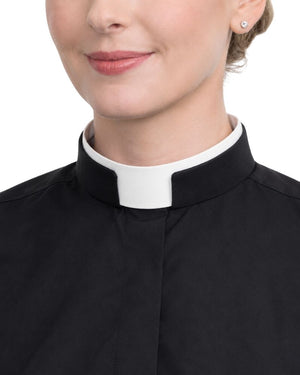 A close-up of a women wearing a black clerical-style collar with a white tab, likely a priest or minister collar, against a plain white background.