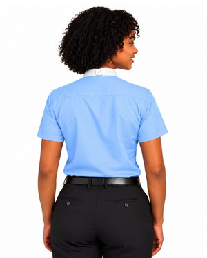 A woman shown from the back wearing a light blue short-sleeve clerical shirt tucked into black trousers with a black belt, against a plain white background.