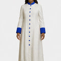 Woman wearing a long white robe with blue accents on a white background