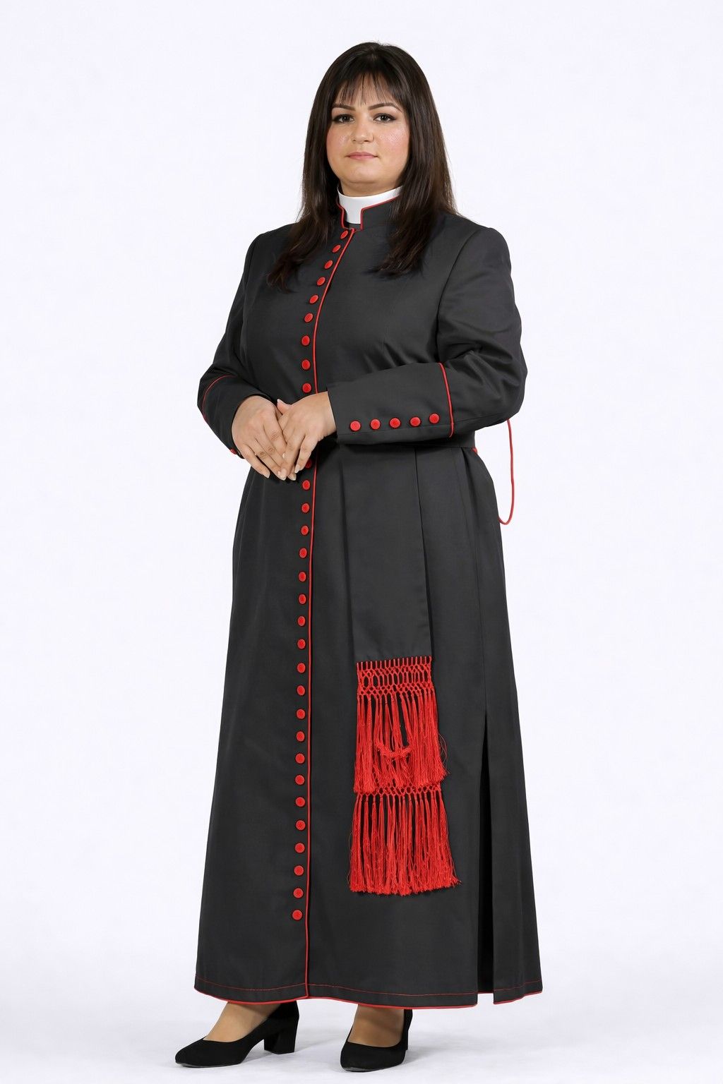 Woman wearing a black robe with red accents on a white background