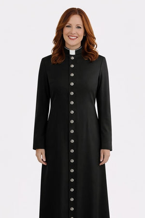 Woman wearing a black long coat with silver buttons on a white background