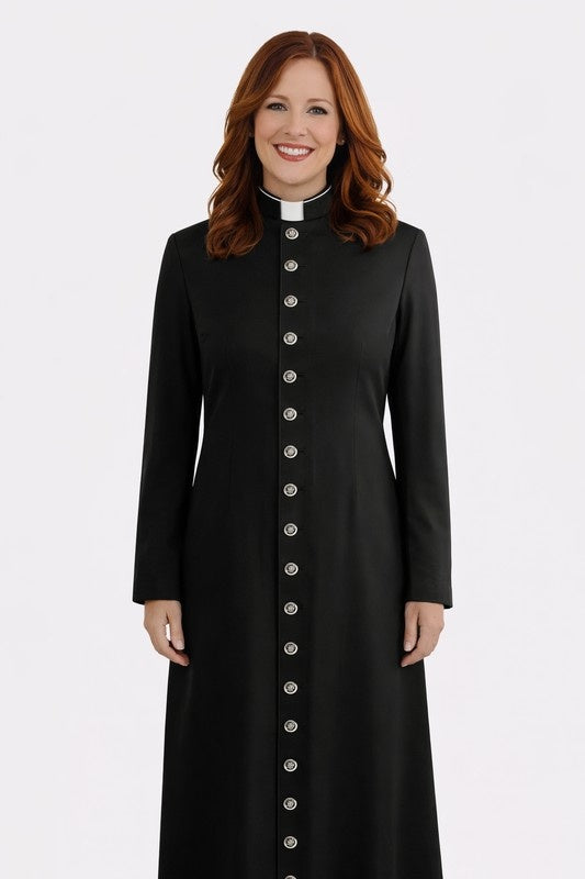 Woman wearing a black long coat with silver buttons on a white background