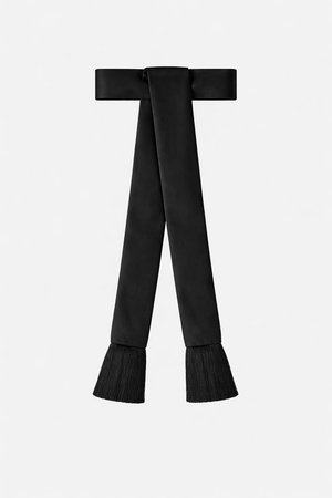 Black sash with frayed ends on a white background
