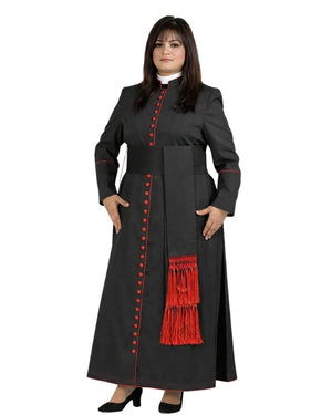 A woman modeling a long black cassock with red trim, red decorative buttons, and a red fringed detail on the front, set against a plain white background.