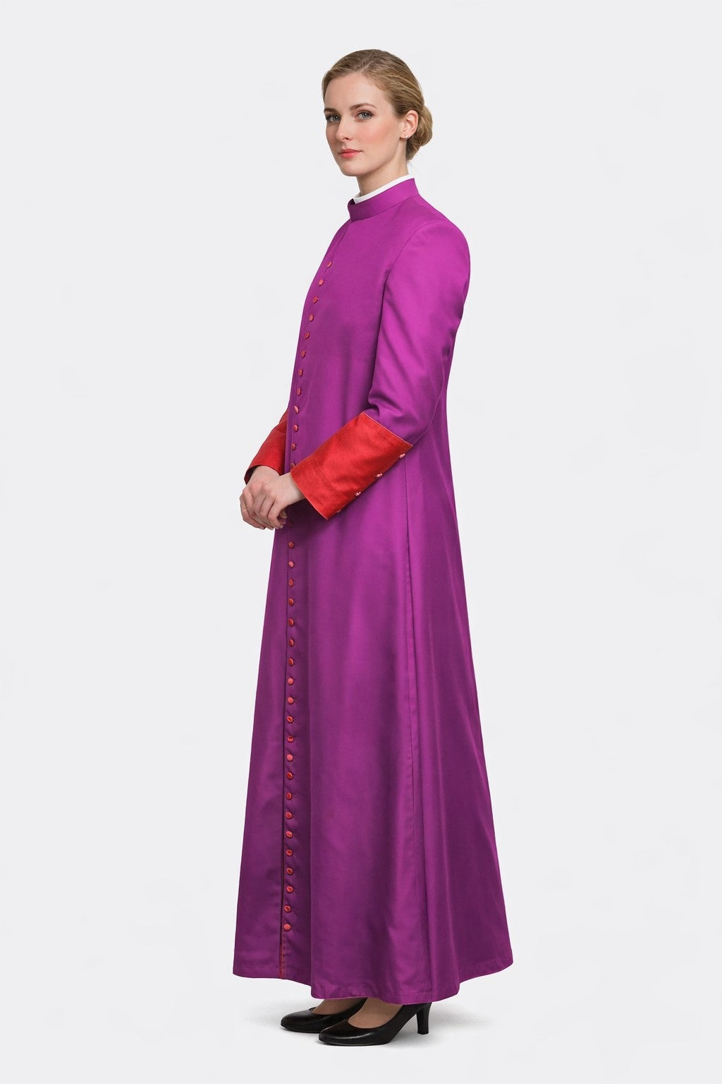 Woman wearing a long purple dress with red sleeves on a white background