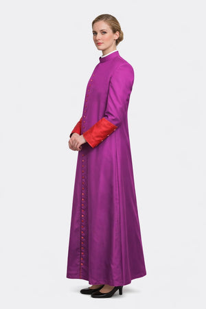 Woman wearing a long purple dress with red sleeves on a white background