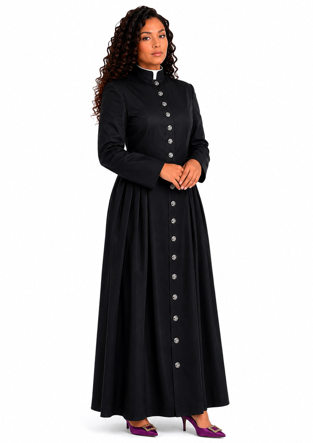 Woman wearing a long black robe with buttons on a white background