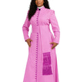 A woman modeling a bright pink long-sleeve cassock with a high collar, decorative front buttons, a matching waist sash, and a purple fringe detail on the skirt, set against a plain white background.