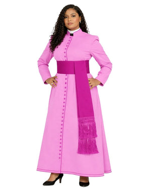 A woman modeling a bright pink long-sleeve cassock with a matching wide waist belt and a draped magenta scarf with fringe, set against a plain white background.