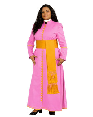 A woman modeling a bright pink cassock with gold trim, gold buttons, and a gold fringe detail on the front, paired with a white collar and black shoes, against a plain white background.