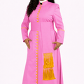 Woman wearing a pink dress with yellow accents on a white background