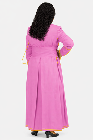 Woman wearing a pink dress with yellow trim on a white background