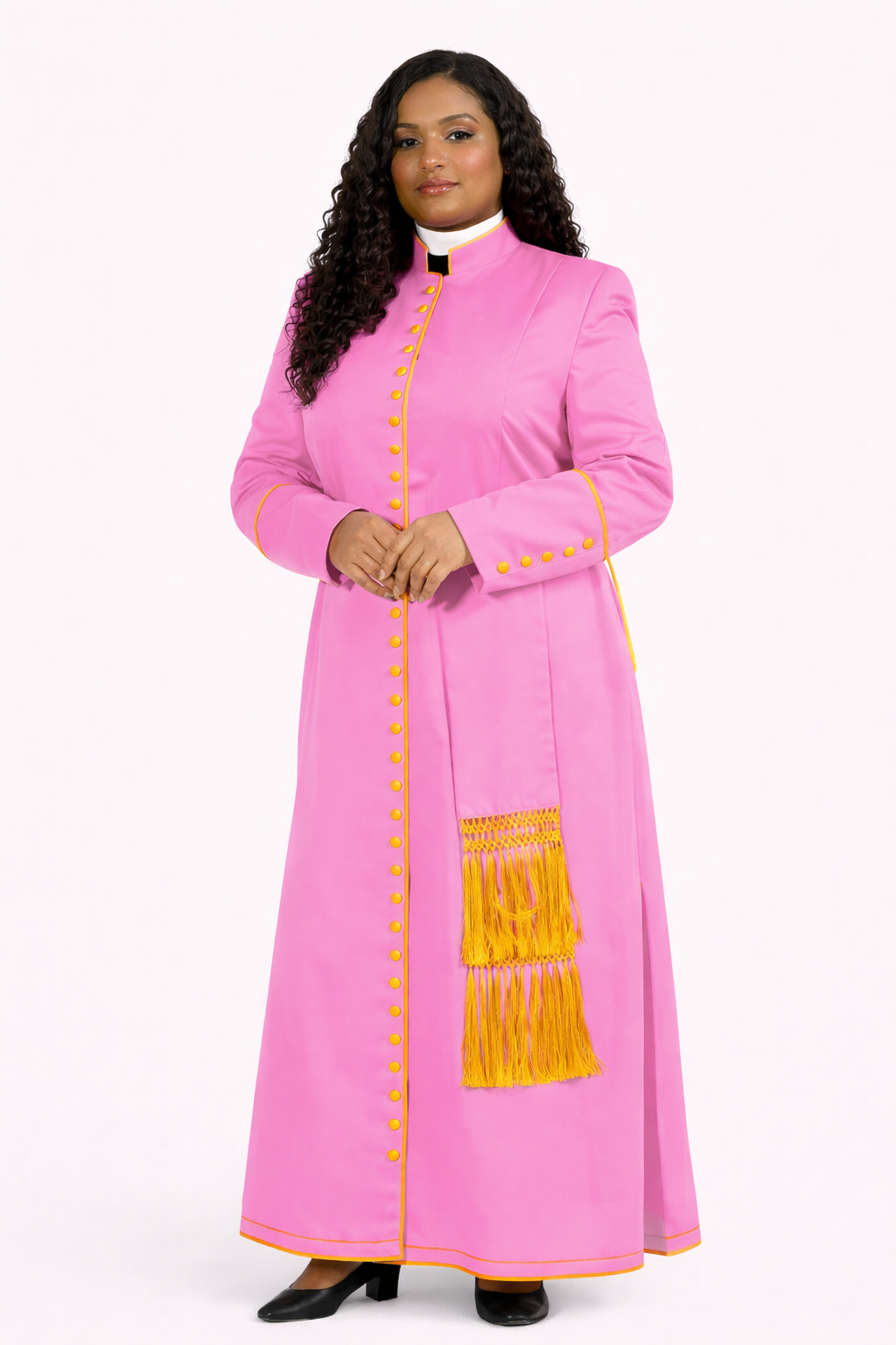 Woman wearing a pink traditional outfit with yellow accents on a white background