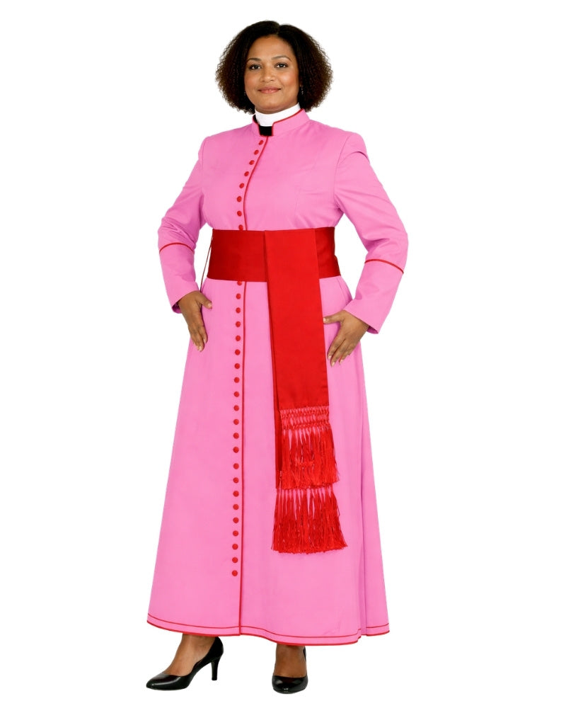 A woman modeling a pink cassock costume with a wide red waist sash and a red hanging scarf with fringe, against a plain white background.