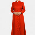 Women wearing a red clerical robe on a white background