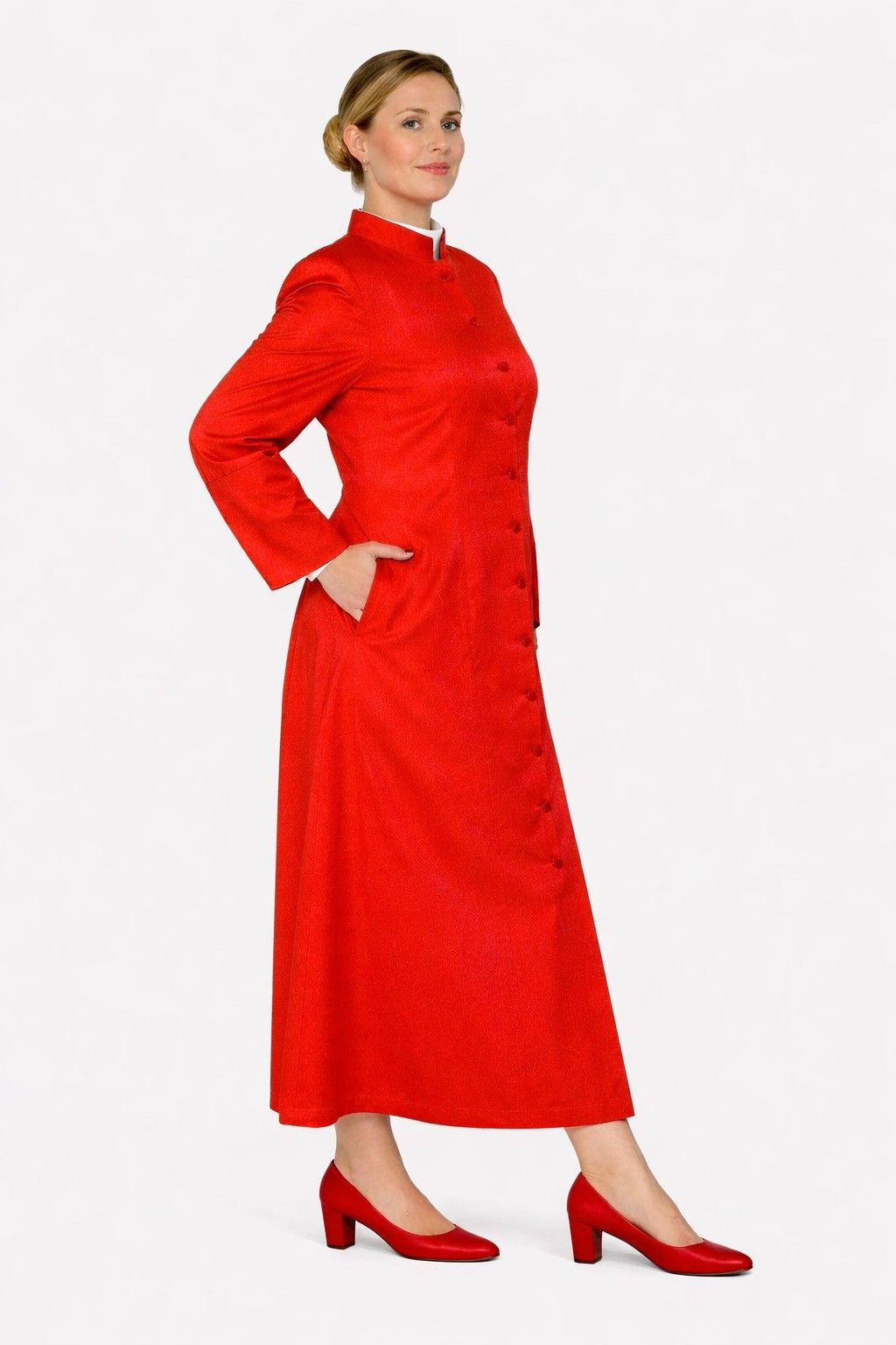 Woman wearing a red robe with buttons on a white background