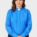 women wearing a blue shirt with a white collar on a plain background