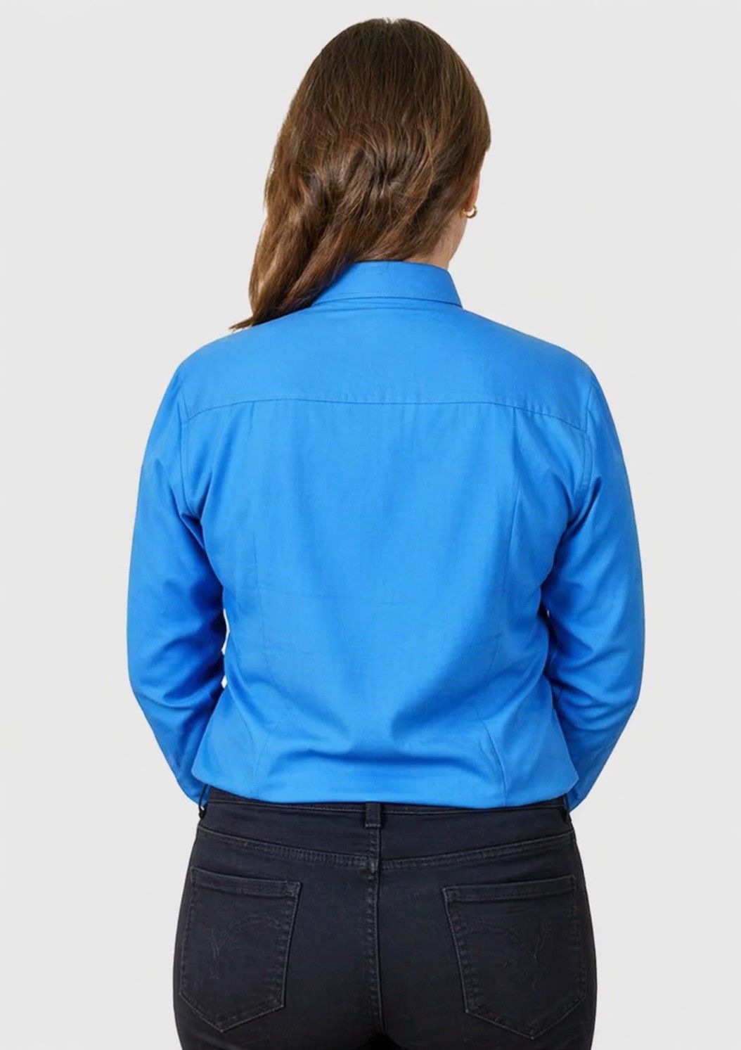 women wearing a blue shirt on a plain background