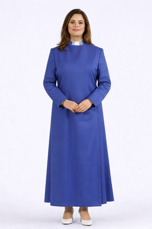 Woman wearing a long blue dress on a white background