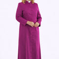 Woman wearing a long purple robe on a white background