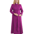A woman modeling a long magenta-purple clerical robe with a high collar, front buttons, and a matching waist tab, worn over a white collar, on a plain white background.