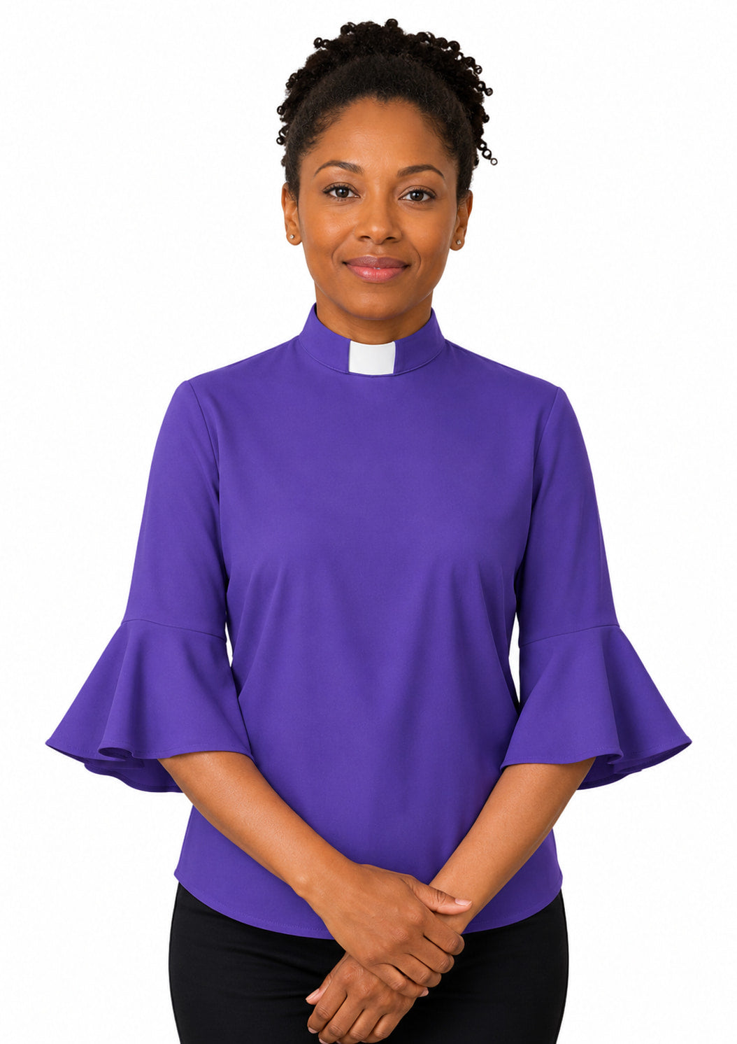 Woman wearing a purple shirt with ruffled sleeves on a white background