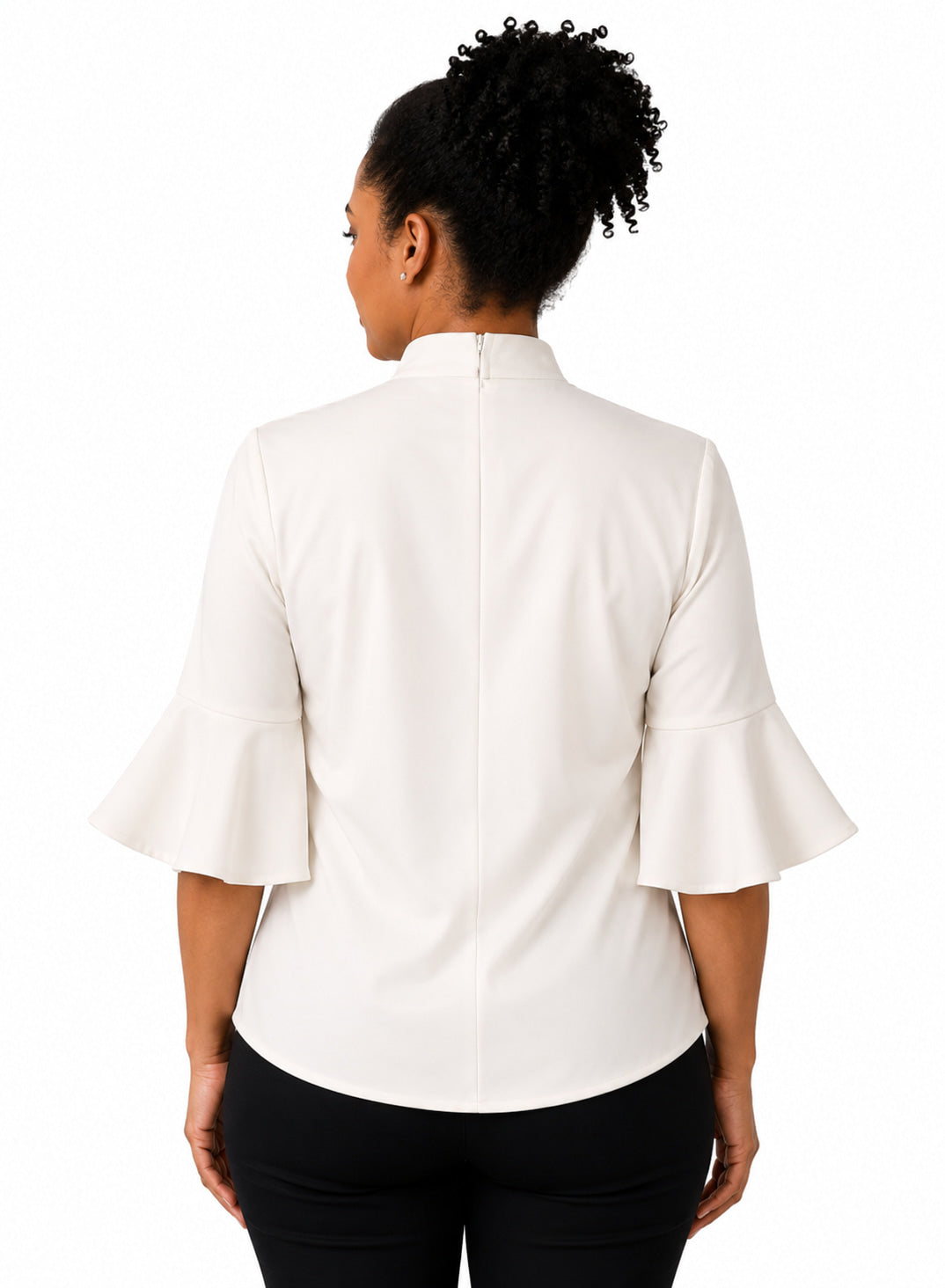 Woman wearing a white shirt with a high collar on a white background