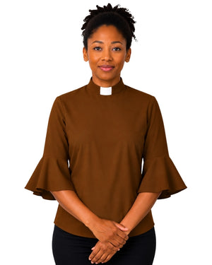 Woman wearing a brown clergy shirt with a white collar on a white background.