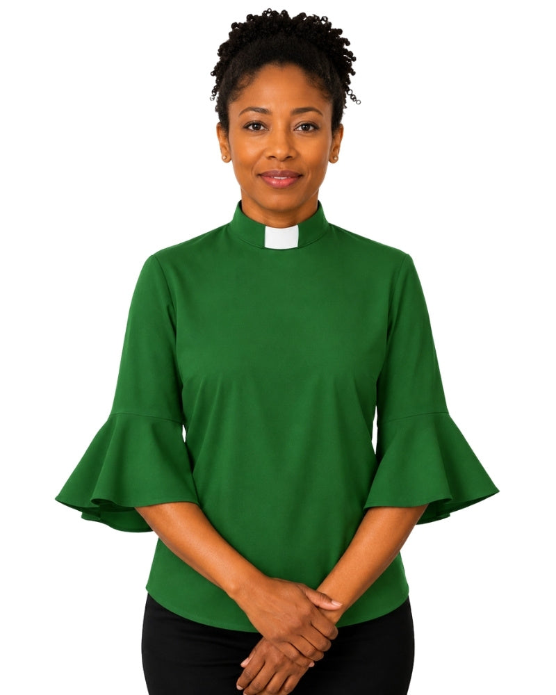 Woman wearing a green clergy shirt with a white collar on a white background.