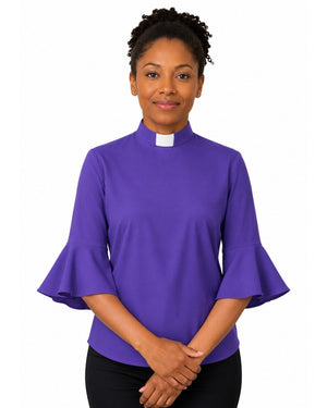 Woman wearing a purple clergy shirt with a white collar on a white background.