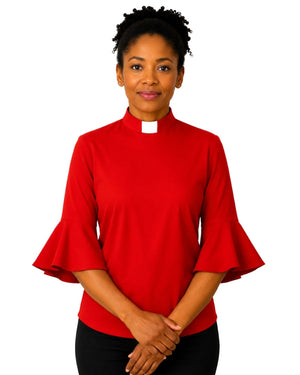 Woman wearing a red clergy shirt with a white collar on a white background.