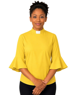 Woman wearing a yellow clergy shirt with a white collar on a white background.