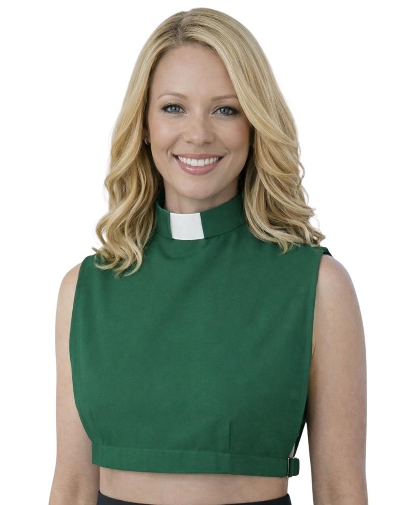 A smiling woman wearing a green sleeveless mock-neck top with a white clerical collar, shown against a plain white background.