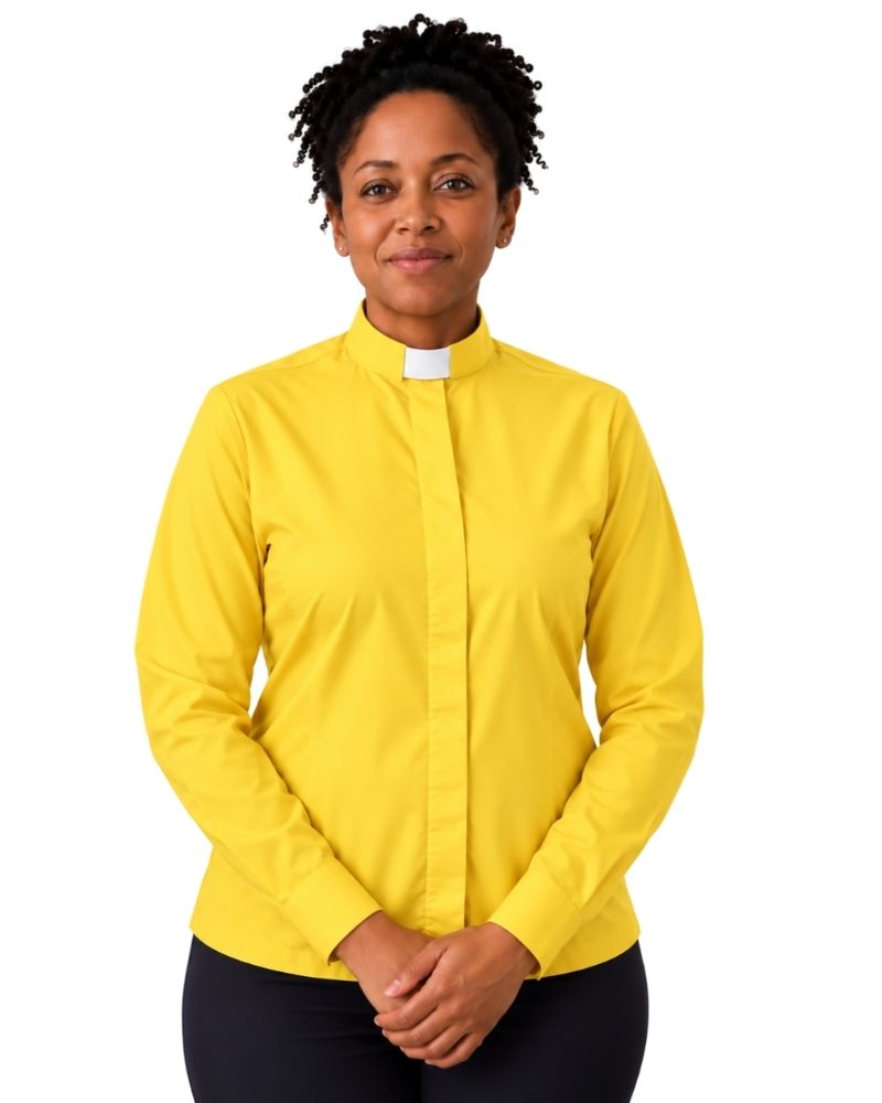 A woman wearing a bright yellow long-sleeve clerical shirt with a white collar tab, paired with black pants, standing against a plain white background.