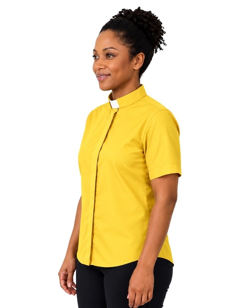 A woman wearing a bright yellow short-sleeve clerical shirt with a white collar tab, paired with black pants, shown in profile against a plain white background.