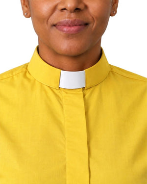 A close-up of a woman wearing a bright yellow clerical shirt with a white clerical collar insert, shown against a plain white background.
