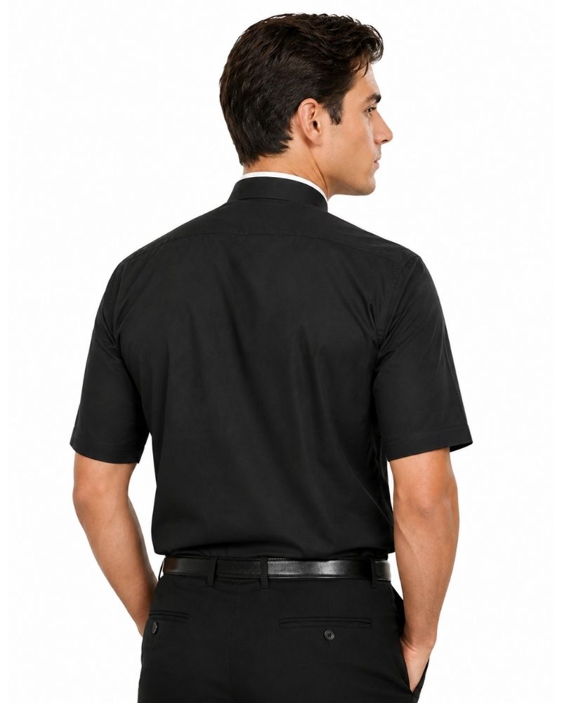 A man shown from the back wearing a black short-sleeve button-up shirt, black trousers, and a black belt against a plain white studio background.