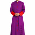 Man wearing a purple robe with red accents on a white background