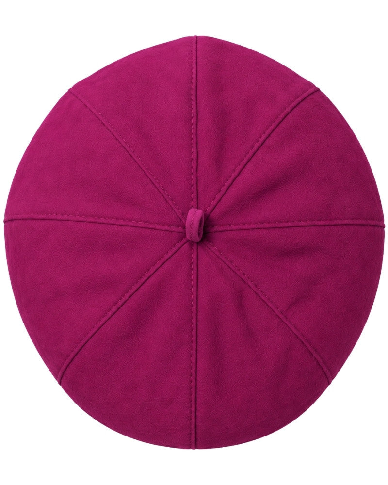 A top-down view of a magenta clergy zucchetto cap on a solid white background.