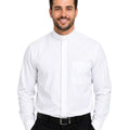 Man wearing a white dress shirt and black pants on a white background